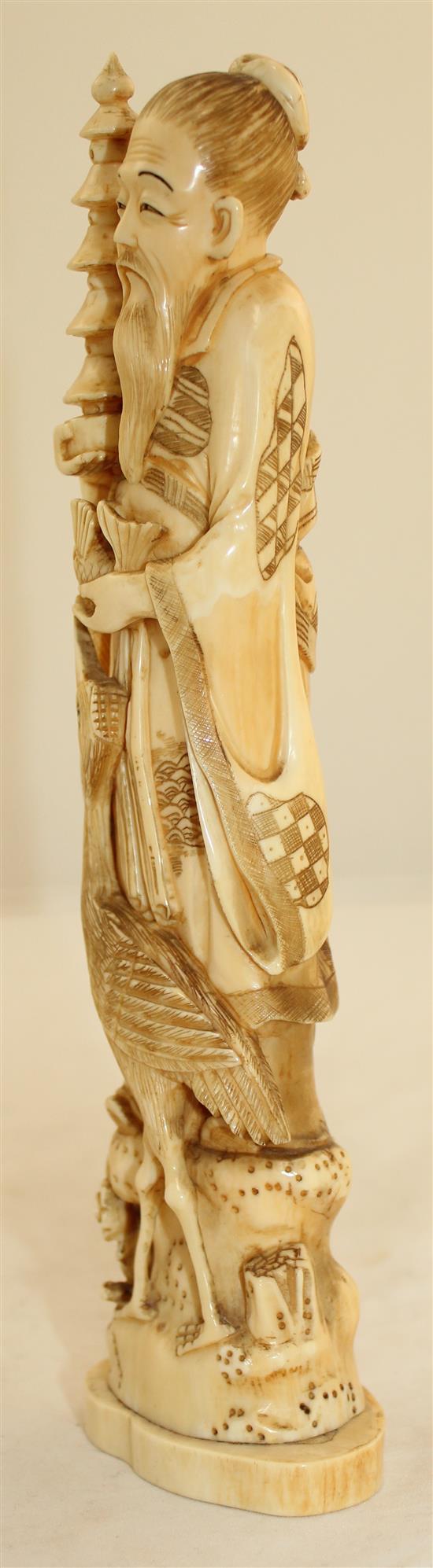 A Japanese walrus ivory figure of an immortal, early 20th century, 23.7cm